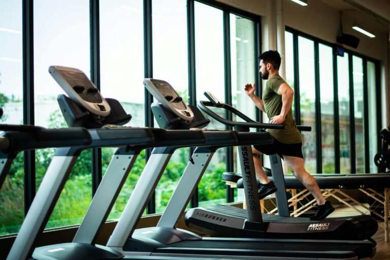mans running on the treadmills